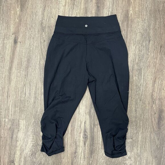 Lululemon Size 10 Pants Sun Salutation Crop Black Fold Over Waist Ruched Loose - Picture 5 of 14